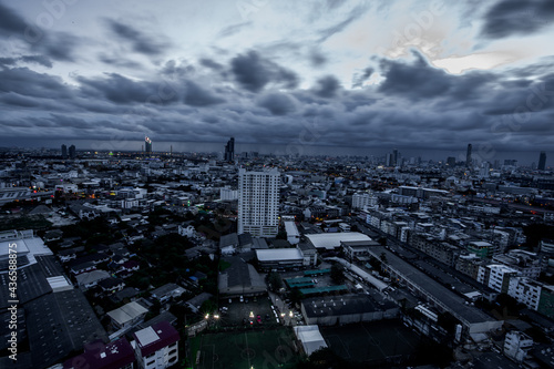 The high angle background of the city view with the secret light of the evening  blurring of night lights  showing the distribution of condominiums  dense homes in the capital community