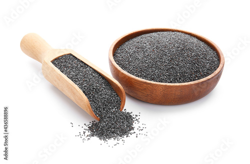 Bowl and scoop with poppy seeds on white background