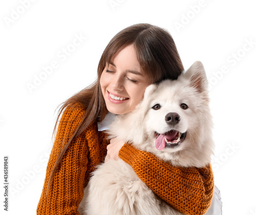 Fotografiet Beautiful woman with cute dog on white background