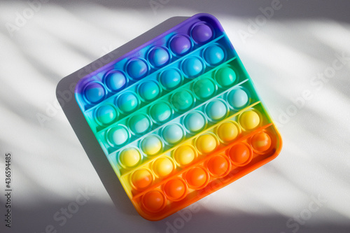 Colorful rainbow anti-stress fidget push pop it sensory toys for children. Simple dimple. 