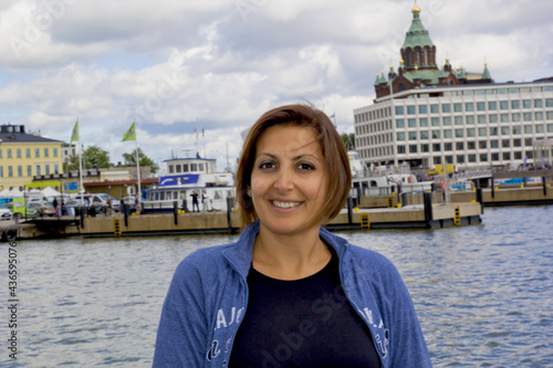 beautiful young woman smilng at camera in helsinki finland