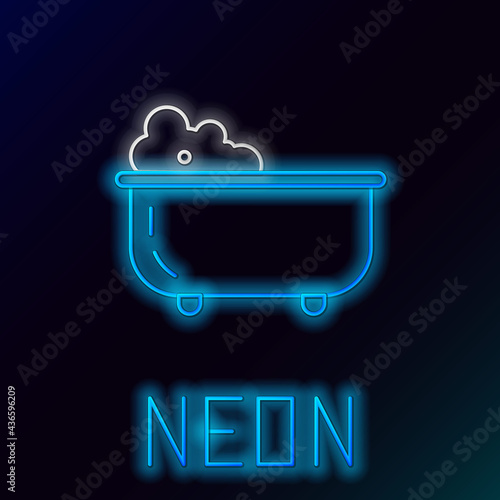 Glowing neon line Baby bathtub with foam bubbles inside icon isolated on black background. Colorful outline concept. Vector