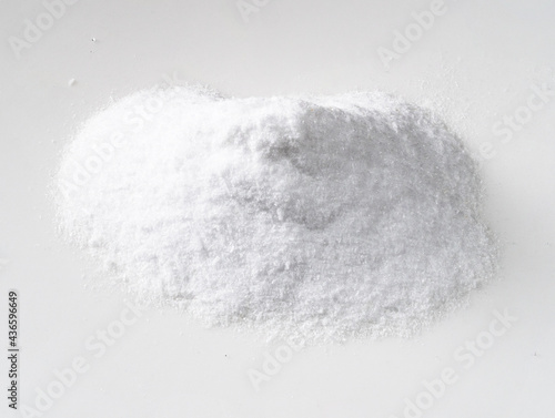 pile of dextrose crystalline sugar on white