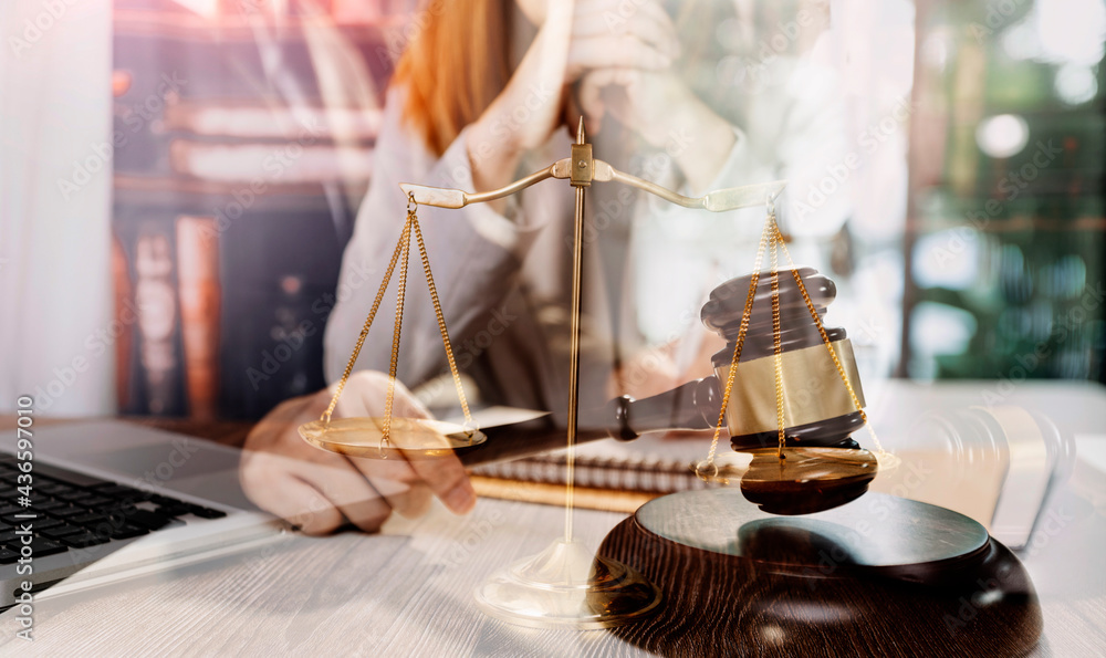 justice and law concept.Male judge in a courtroom on wooden table and Counselor or Male lawyer working in office. Legal law, advice and justice concept. justice and law concept.Male judge in a courtroom on wooden table and Counselor or Male lawyer working in office. Legal law, advice and justice concept.