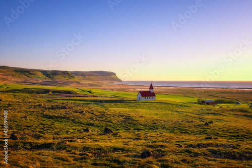 Sunset at the Breidavik church in Westfjords, Iceland photo