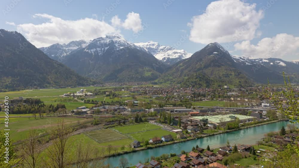 Time Lapse aerial view on the town in Swiss Alps between lakes. Interlaken, Canton Bern, Switzerland. Time Lapse aerial view on the town in Swiss Alps between lakes. Interlaken, Canton Bern, Switzerland.