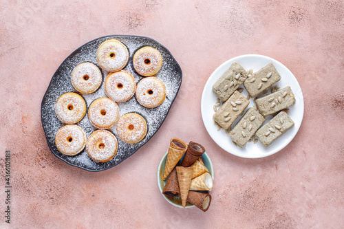 Homemade mini donuts with powdered sugar.