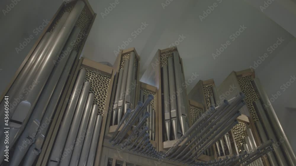 Camera panning along large organ with large organ pipes in a church Camera panning along large organ with large organ pipes in a church