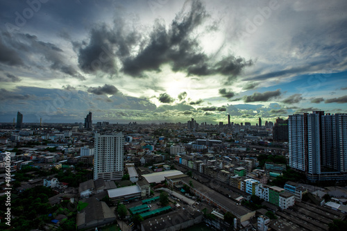 The high angle background of the city view with the secret light of the evening  blurring of night lights  showing the distribution of condominiums  dense homes in the capital community