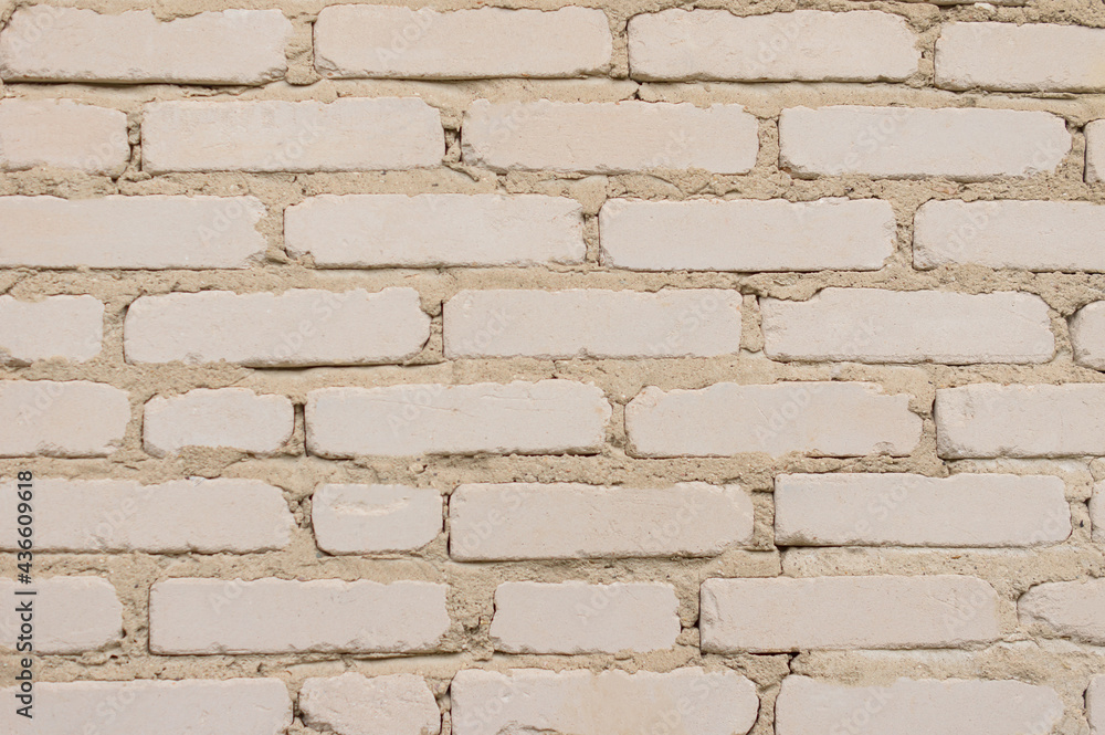 Weathered white stained old brick wall background Weathered white stained old brick wall background