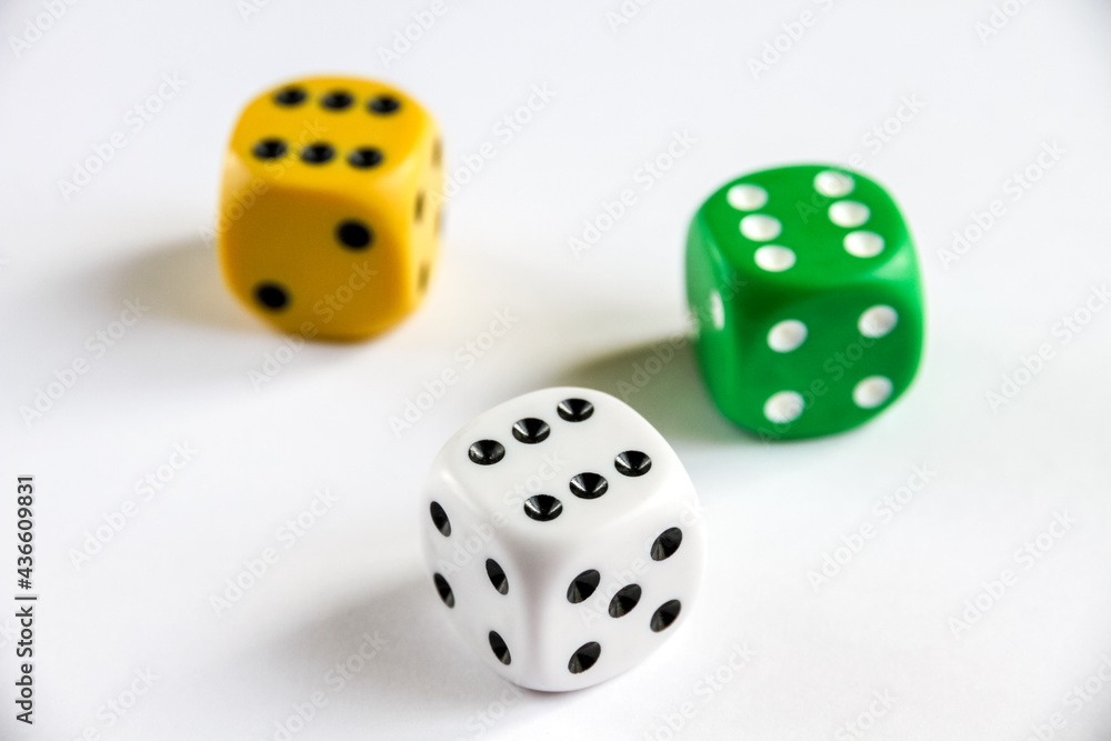 Three colorful dices isolated on white background Three colorful dices isolated on white background