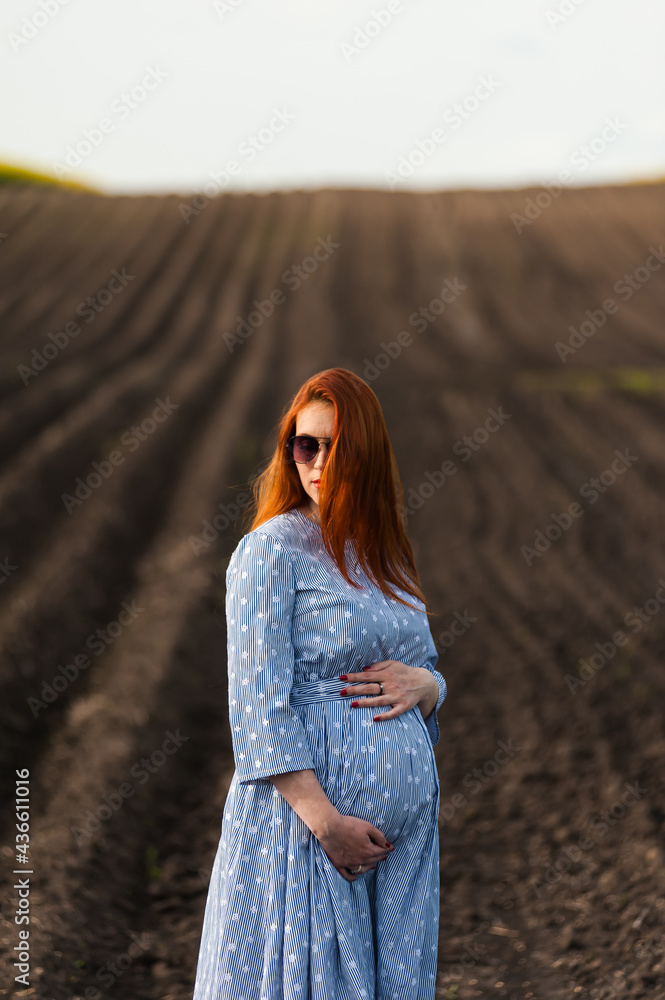 Pregnant woman on the summer field Pregnant woman on the summer field