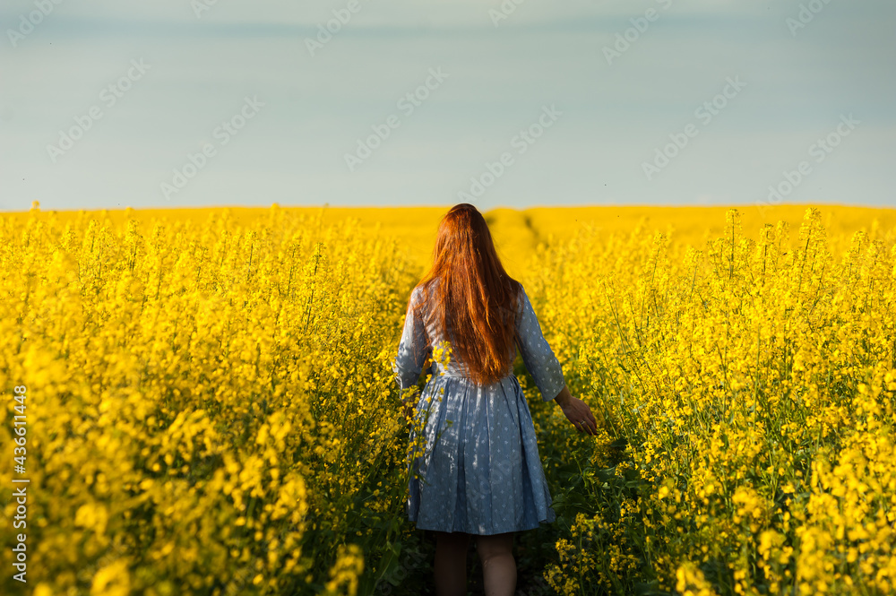 Fototapeta premium Beautiful pregnant woman portrait on the agriculture field