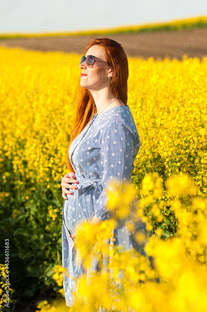 Pregnant woman portrait on the field Pregnant woman portrait on the field