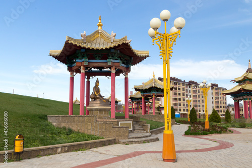 Elista, Russia. Buddhist complex Golden Abode of Buddha Shakyamuni in Kalmykia (Great Hurul). Statues of buddhism teachers in the park in front of the building photo