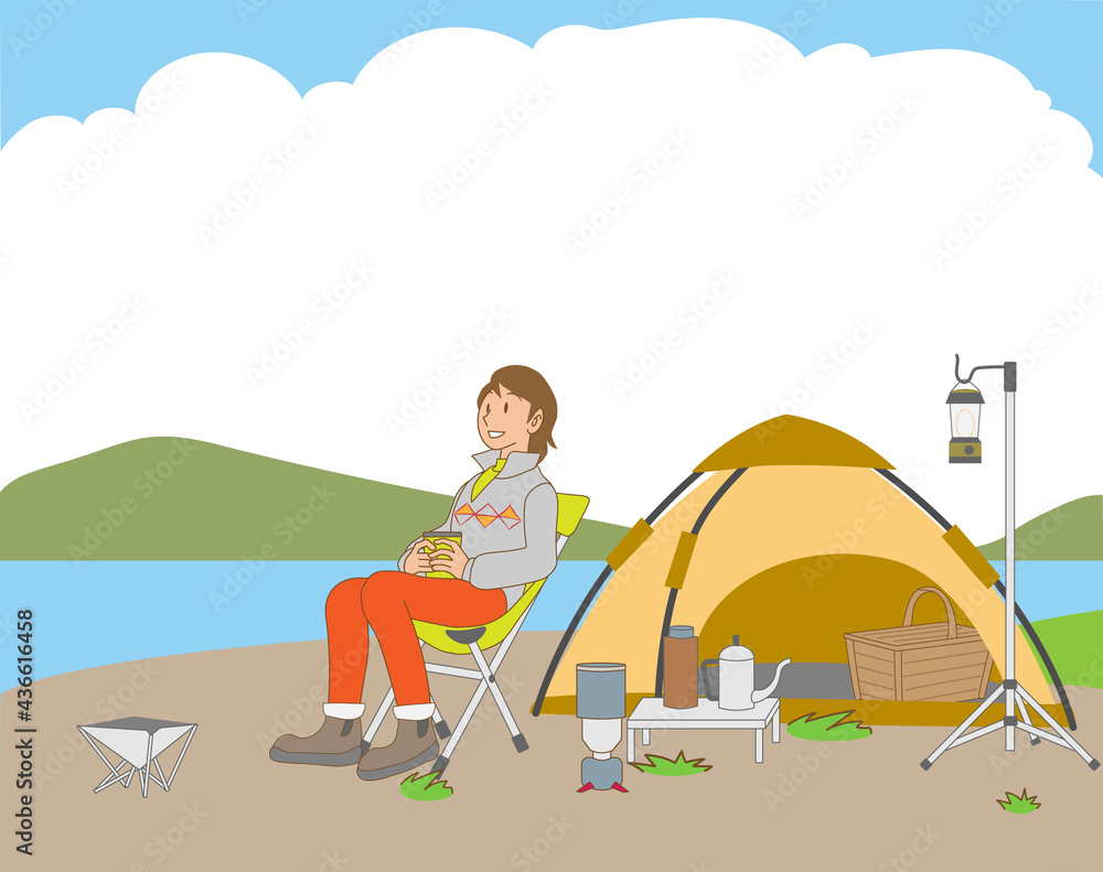 湖畔でソロキャンプを楽しむ女性