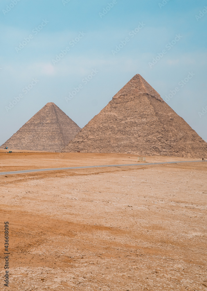 Vertical shot of the pyramids in Giza, Egypt on a foggy day Vertical shot of the pyramids in Giza, Egypt on a foggy day
