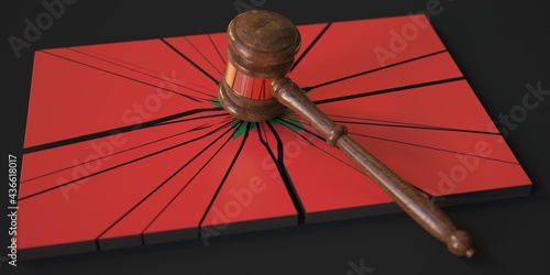 Broken block with flag of Morocco and judge's gavel. Conceptual 3d rendering