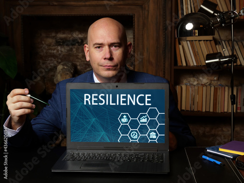  RESILIENCE sign on the computer. The power or ability of a material to return to its original form, position  after being bent, compressed, or stretched