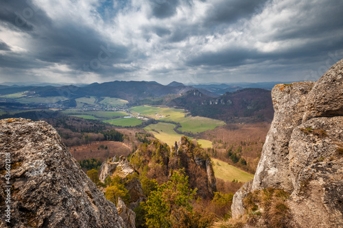 View of the mountainous landscape with rock formations in partly cloudy weather. National Nature Reserve Sulov Rocks, Slovakia, Europe.