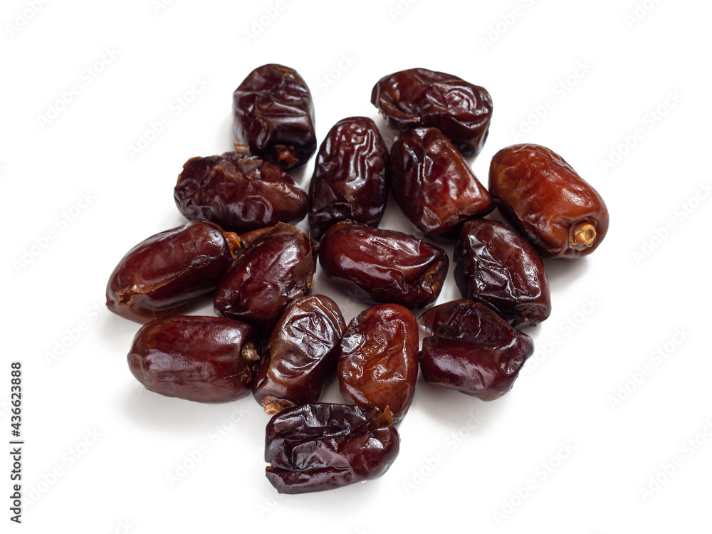 Dried dates - date palm fruit on a white background