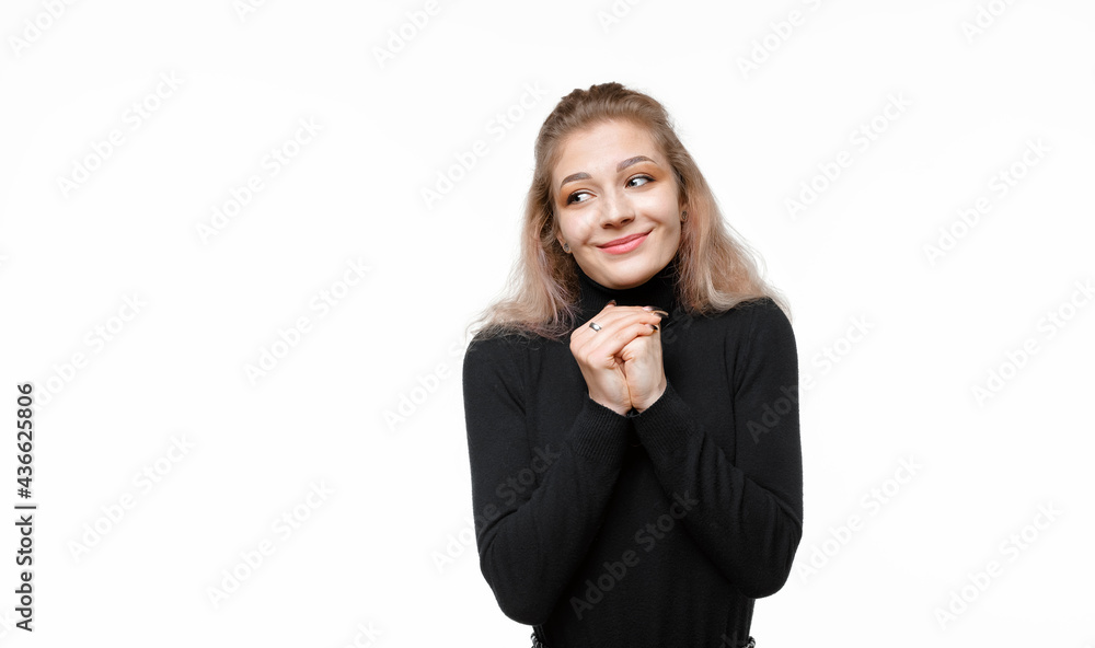Portrait of dreamy young woman making wish, clench fists close to chest, praying hopeful. Luck and dreams concept Portrait of dreamy young woman making wish, clench fists close to chest, praying hopeful. Luck and dreams concept