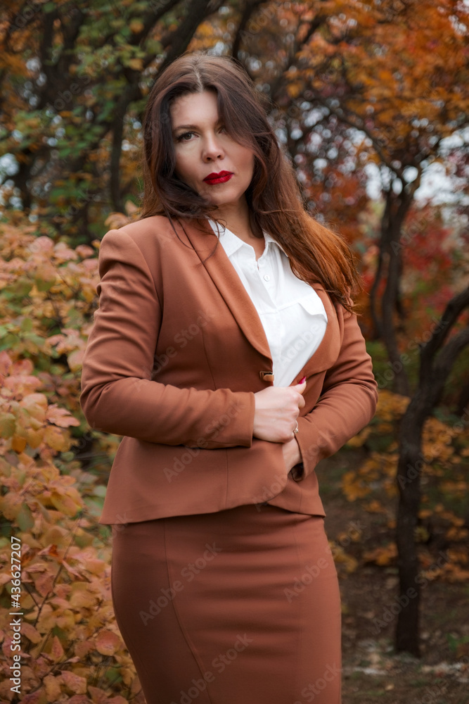 Portrait of a gorgeous middle-aged woman in an autumn park Portrait of a gorgeous middle-aged woman in an autumn park