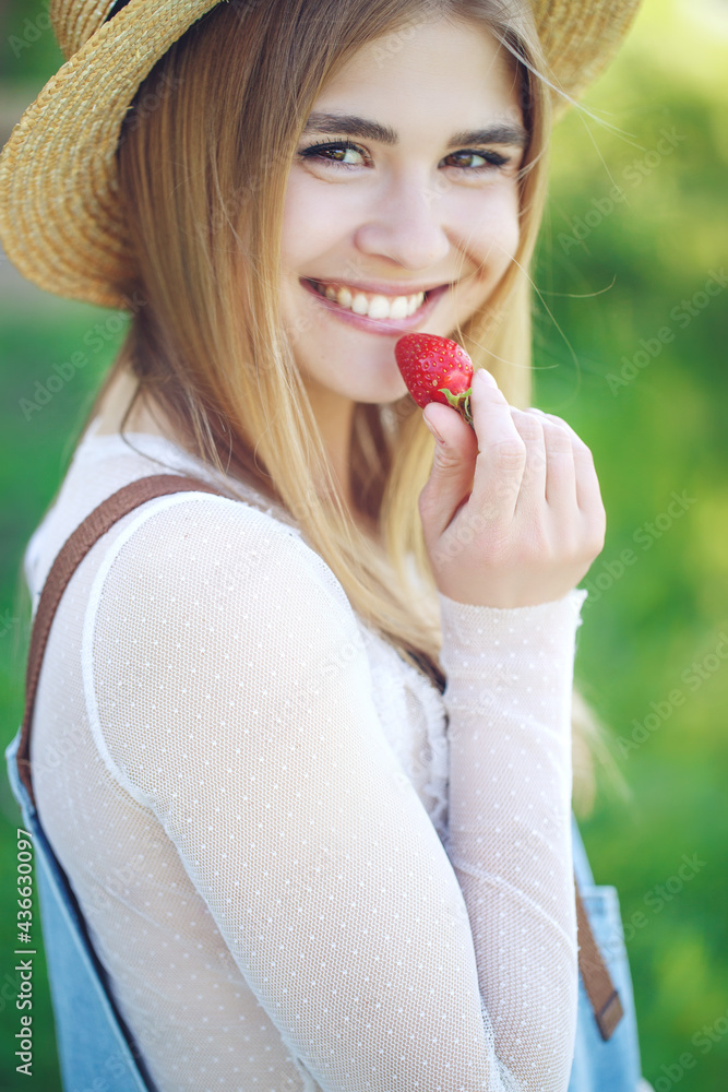Shot of a young woman using fresh strawberries. Close-up of attractive woman with strawberry. High quality photo. Shot of a young woman using fresh strawberries. Close-up of attractive woman with strawberry. High quality photo.