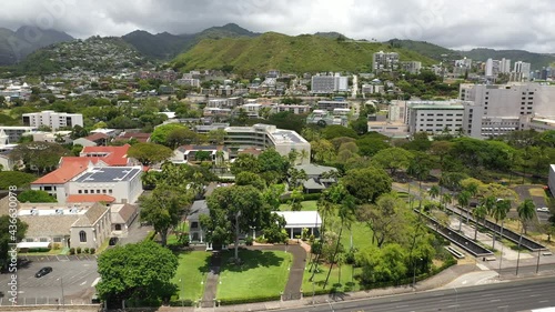 Cinematic 4K aerial drone footage of The Queen's Medical Center, Punchbowl Crater downtown Honolulu, on Oahu island in Hawaii known for its surfing and beaches