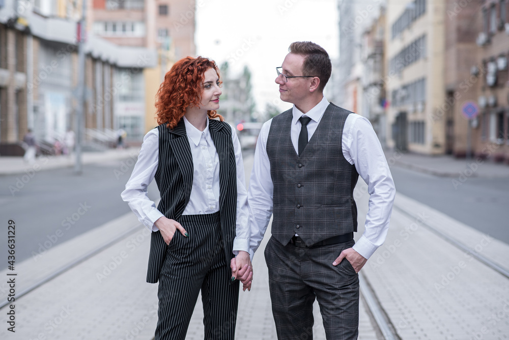 Portrait of redhead husband and wife holding hands Portrait of redhead husband and wife holding hands