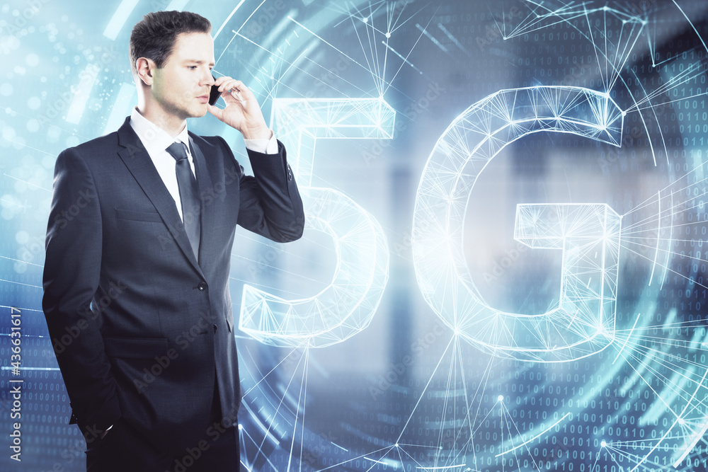 Thoughtful young businessman talking on the phone on blurry city background with glowing 5G hologram. Communication and internet speed concept. Double exposure. Thoughtful young businessman talking on the phone on blurry city background with glowing 5G hologram. Communication and internet speed concept. Double exposure.