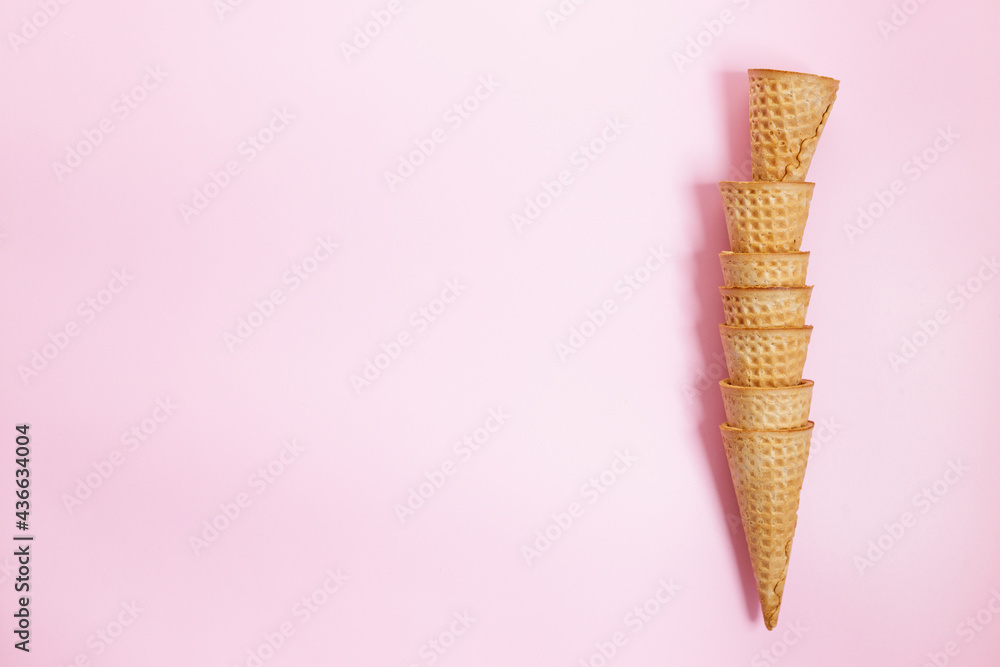 Ice cream cones on pink color background.