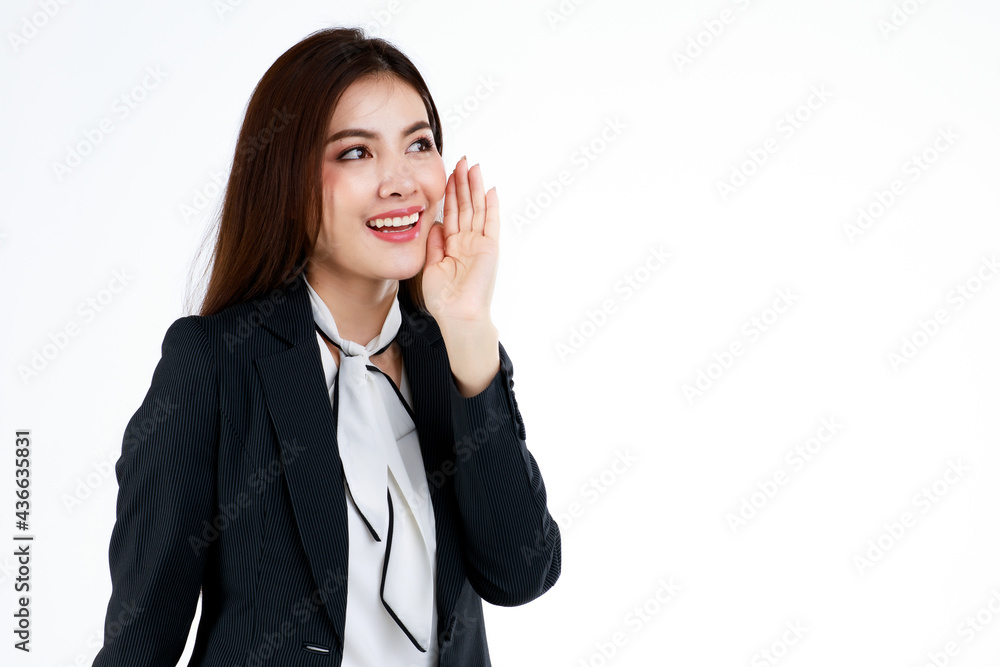 Portrait of young Asian businesswoman model in formal suit uses hands and action in a pose of presenting or demonstrate goods or product in advertising gesture, studio shot on white background Portrait of young Asian businesswoman model in formal suit uses hands and action in a pose of presenting or demonstrate goods or product in advertising gesture, studio shot on white background