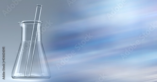 Composition of stirrer in empty chemistry flask, with blurred white and blue copy space to right