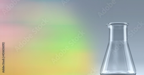 Composition of empty conical flask, with blurred colourful copy space