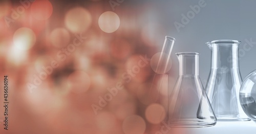 Composition of empty conical flasks and stirrer, with blurred copy space