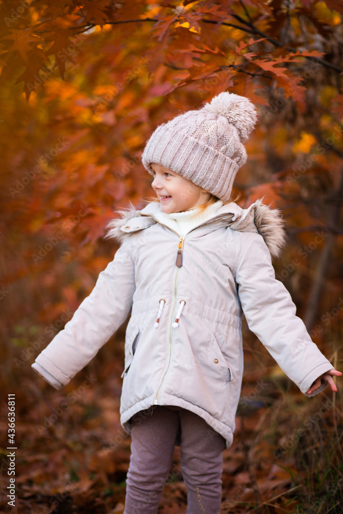 baby girl in autumn park playing with leaves baby girl in autumn park playing with leaves