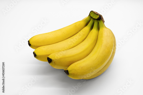 A ripe, delicious yellow banana on a white background.