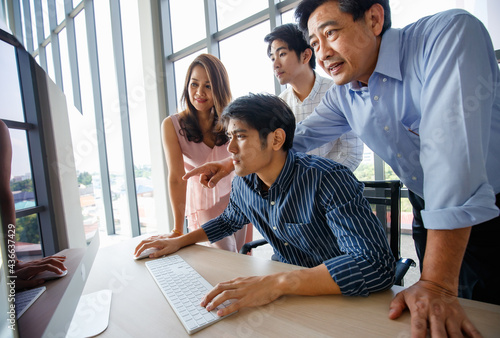 Portrait Asian cheerful attractive family business, working and using computer in comfortable modern office during the day, smiling confidently and believably in success photo