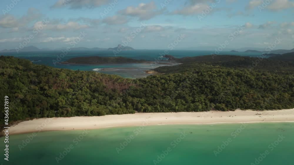 Stunning aerial view of Whitehaven beach with distant islands in Queensland, Australia Stunning aerial view of Whitehaven beach with distant islands in Queensland, Australia