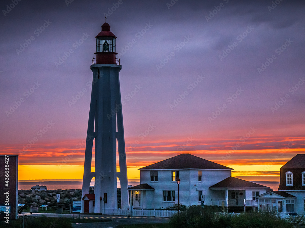 After the rain, incredible sunset over the Pointe au Pere lighthouse in Rimouski, Quebec (Canada)
