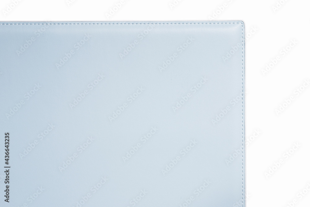 Light-blue fine leather with soft texture. Close-up edge with white threds Light-blue fine leather with soft texture. Close-up edge with white threds