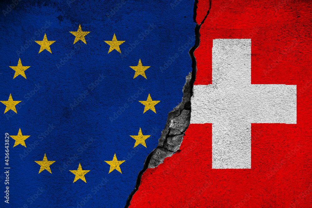 Concept of the Conflict and the Relations between the European Union and Switzerland with painted flags on a wall with a crack and a hole in the middle