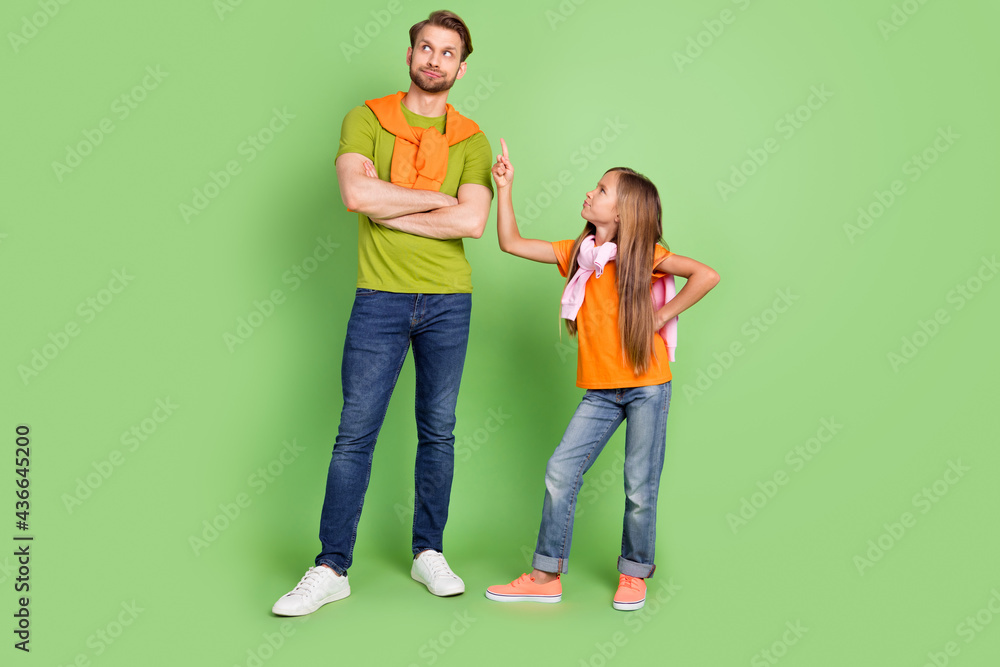 Full length body size view of attractive people girl saying demand to dad daddy isolated over green color background Full length body size view of attractive people girl saying demand to dad daddy isolated over green color background