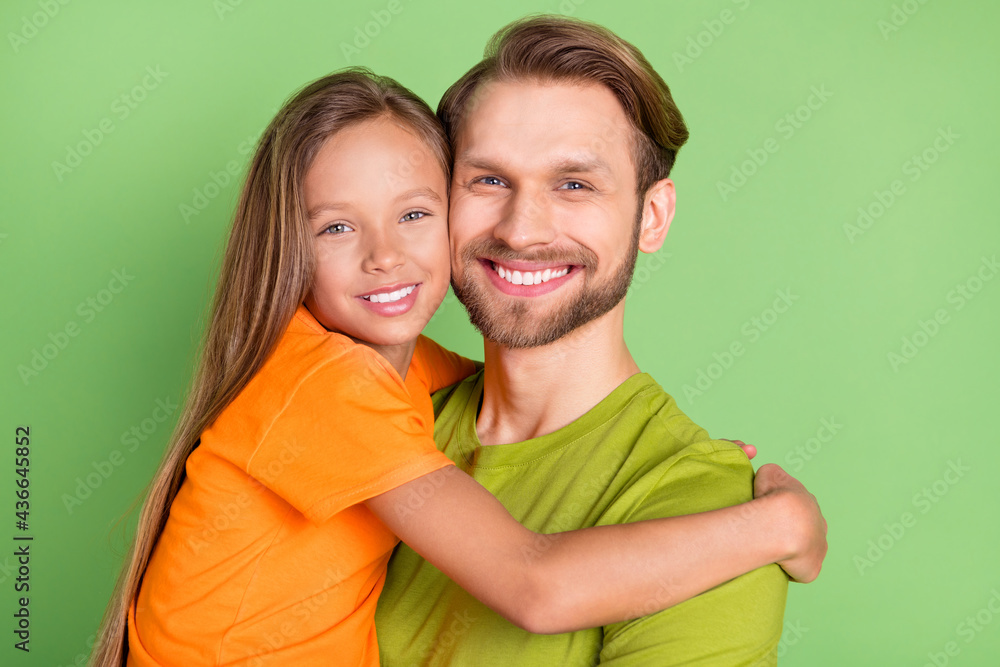 Portrait of attractive cheerful people dad daddy embracing spending time isolated over green color background Portrait of attractive cheerful people dad daddy embracing spending time isolated over green color background