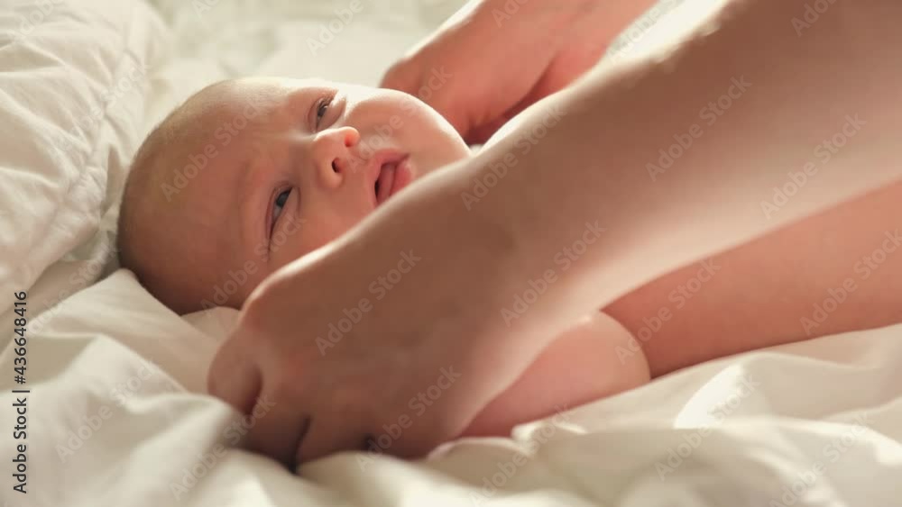 Mother Playing with Baby Hands. Stretching and Exercises for Child Development. Mother Holding Hands Newborn Baby. Concept of Parenthood, Childhood, Maternity, Motherhood. Neonate Toddler with Mom Mother Playing with Baby Hands. Stretching and Exercises for Child Development. Mother Holding Hands Newborn Baby. Concept of Parenthood, Childhood, Maternity, Motherhood. Neonate Toddler with Mom