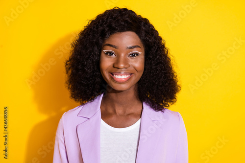 Photo of young beautiful happy cheerful smiling afro businesswoman with curly hair isolated on yellow color background