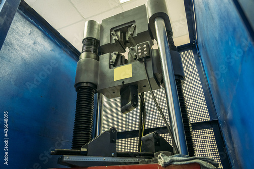 Machine for testing metals for strength and deformation in laboratory at metallurgical plant.