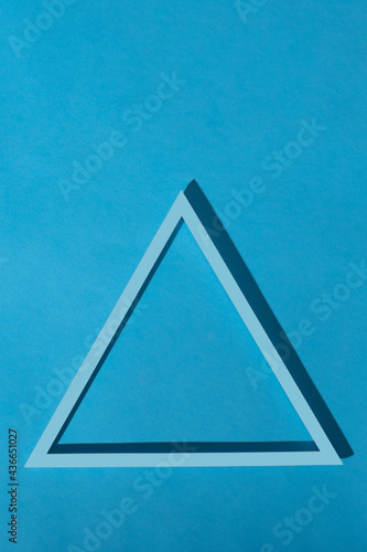 blue triangular frame on a blue background. stock photo