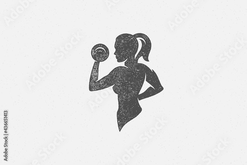 Powerful sportswoman exercising with dumbbells silhouette hand drawn stamp vector illustration.